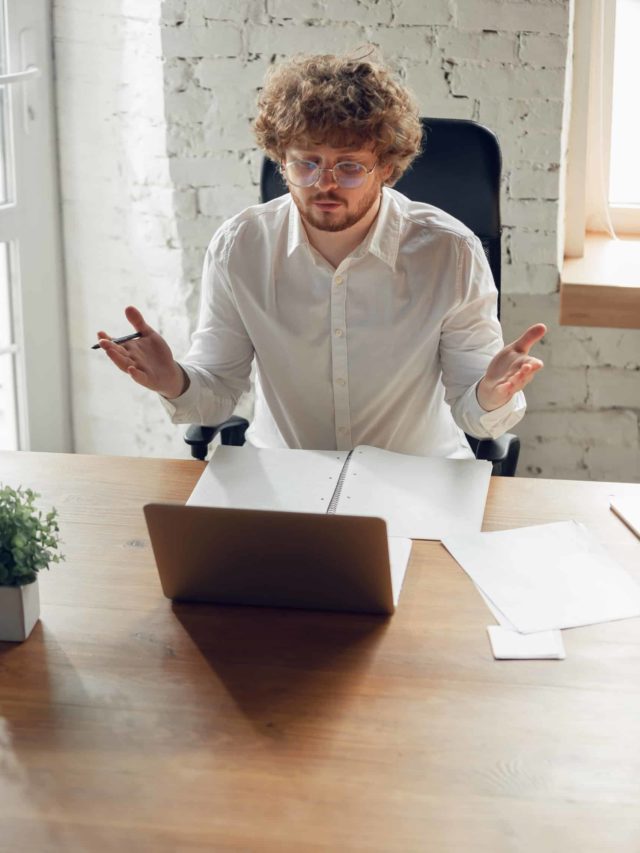 cropped caucasian young man in business attire working in office job online studying scaled 1