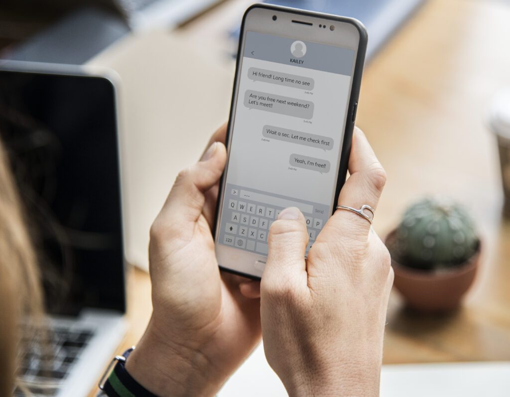 woman chatting her smartphone