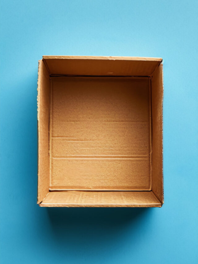 An open cardboard box on a blue background.