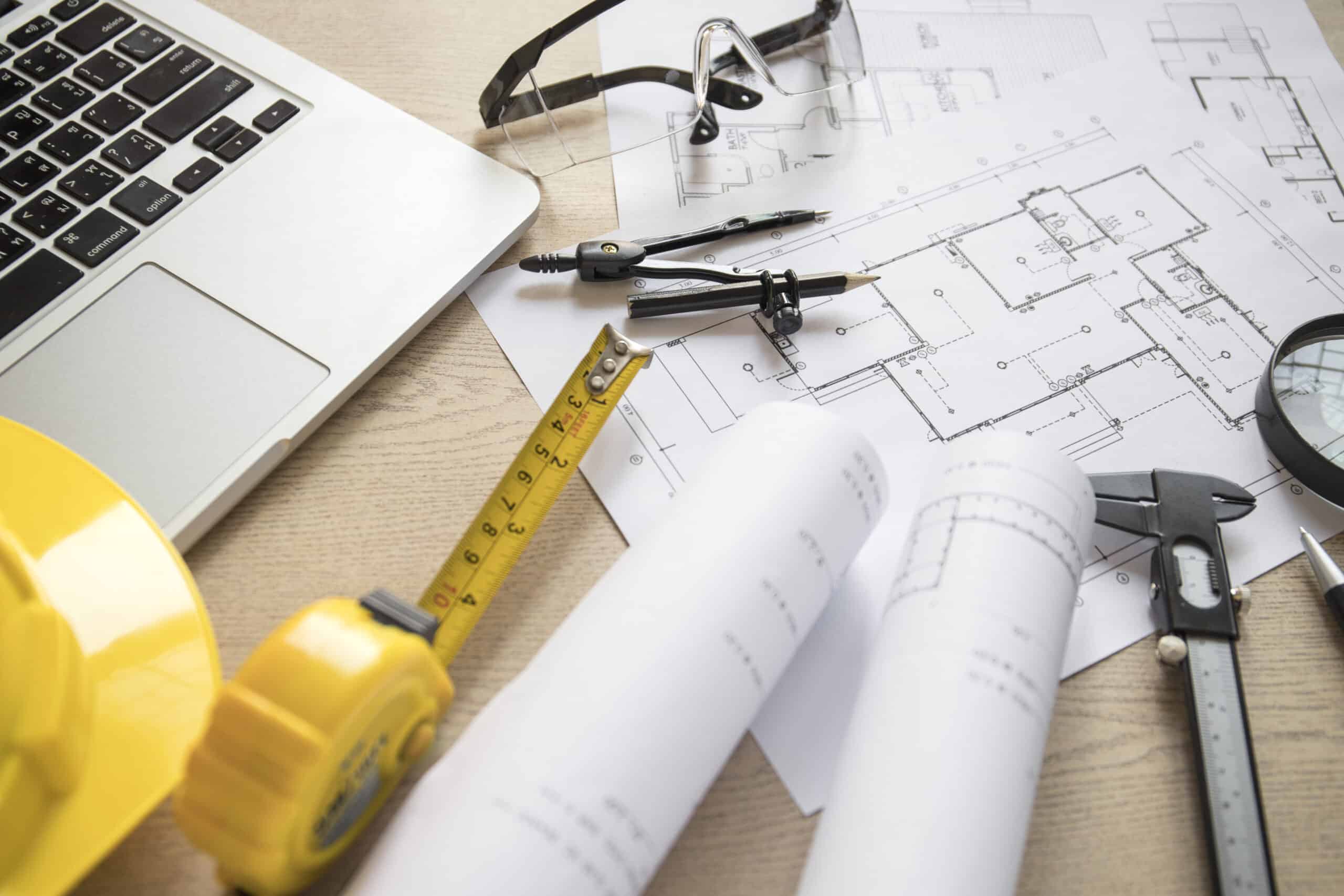blueprints tools near laptop scaled