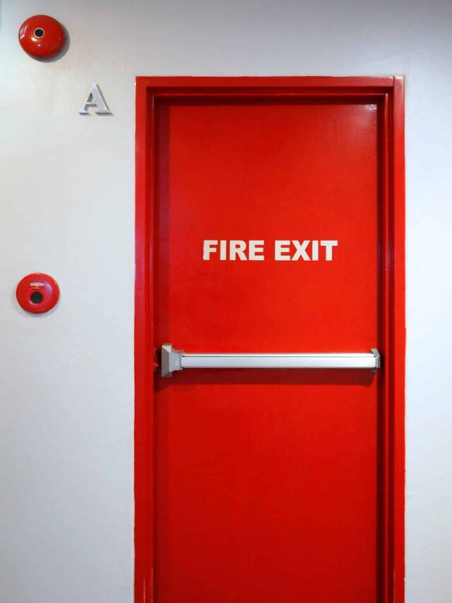 Fire exit emergency door red color metal material.