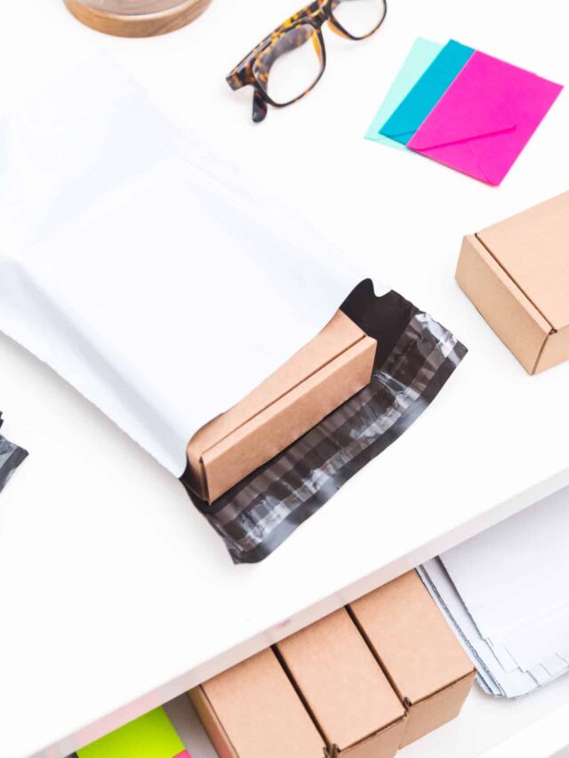 Office desk with post envelopes, top view