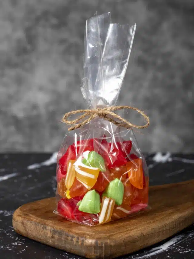 Fruit drops. Packed fruit flavored candy on a dark background