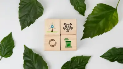 Imagem com blocos de madeira contendo ícones relacionados à sustentabilidade, preservação ambiental, reciclagem e comunicação, cercados por folhas verdes em um fundo branco, representando ações ecologicamente corretas.