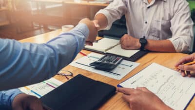 midsection man using laptop table