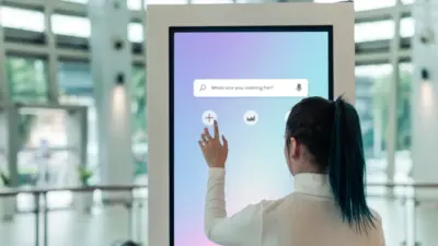 a woman touching a screen