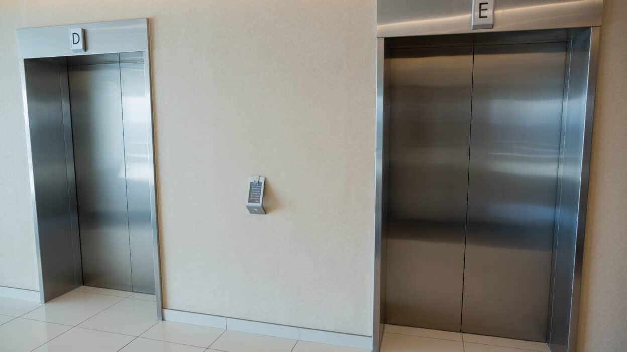 two elevator doors lobby office building