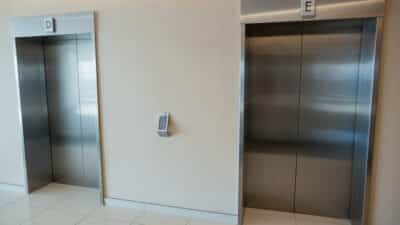 two elevator doors lobby office building
