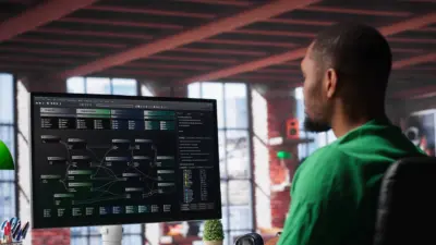 homem trabalhando monitoramento diagrama rede computador escritorio moderno